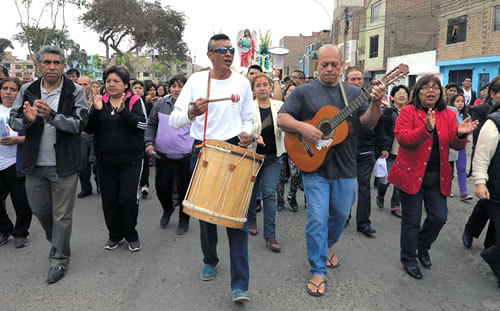 Fr. Napa, on guitar, on a march