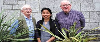 Angie with Fr. Berne Steed (left) and Fr. Oli McCrossan (right)